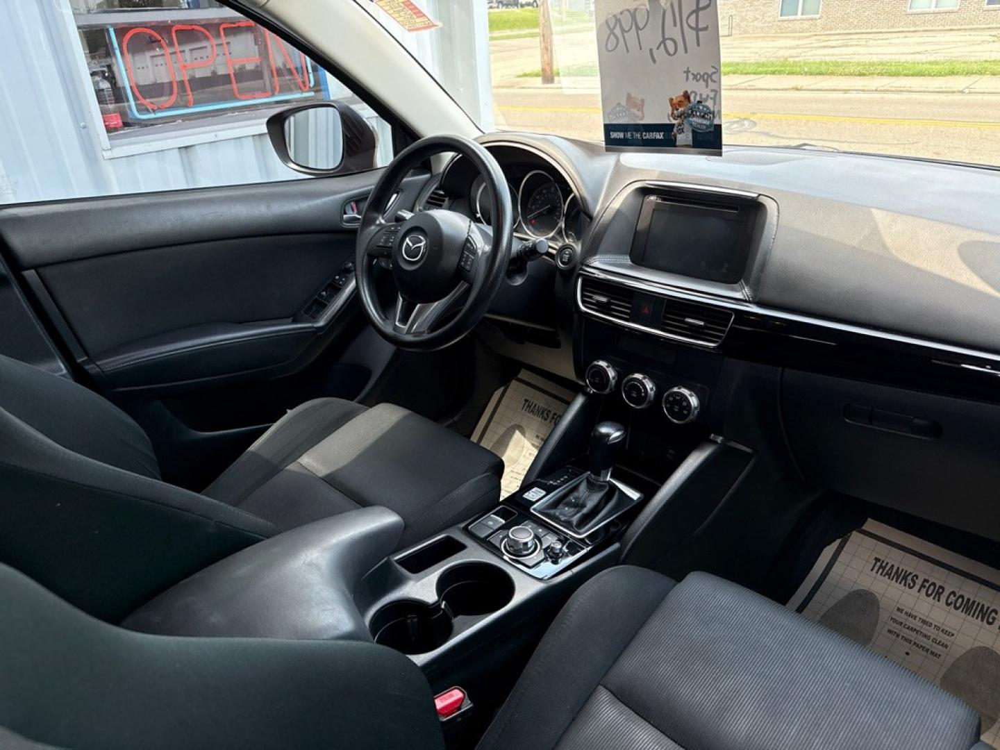 2016 BLACK MAZDA CX-5 SPORT (JM3KE2BY8G0) with an 2.5L engine, Automatic transmission, located at 501 E. Columbia St., Springfield, OH, 45503, (800) 262-7122, 39.925262, -83.801796 - *** 1 Owner *** 29 Records on CarFax *** Back Up Camera *** New Battery *** Inspection *** Oil Change *** Sport *** FWD *** Jay North Auto has offered hand picked vehicles since 1965! Our customer's enjoy a NO pressure buying experience with a small town feel. We are a preferred dealer for many- Photo#13