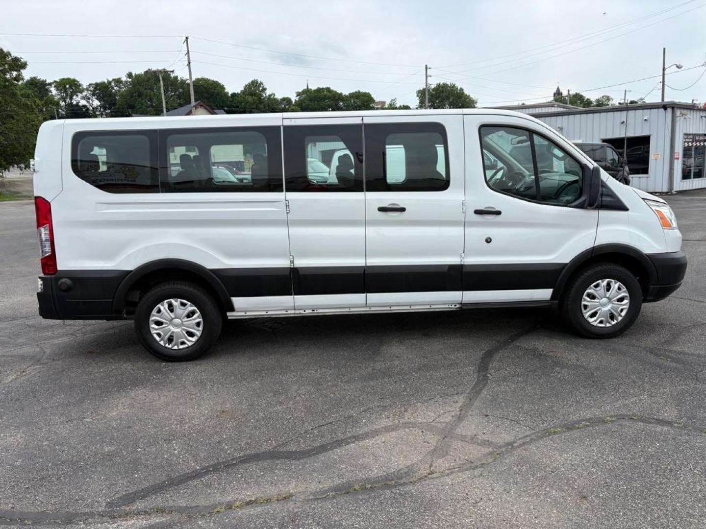 2019 WHITE FORD TRANSIT T-350 XLT (1FBZX2ZM7KK) with an 3.7L engine, Automatic transmission, located at 501 E. Columbia St., Springfield, OH, 45503, (800) 262-7122, 39.925262, -83.801796 - *** Clean CarFax w/ 25 Service Records *** Oil Change *** Inspection *** New Cabin and Air filter *** New Battery *** New Brakes *** 15 Passenger *** OPTIONAL EQUIPMENT/OTHER PREFERRED EQUIPMENT PKG.302A 3.73 RATIO REGULAR AXLE X73 9000# GVWR PACKAGE CHARCOAL CLOTH 2WAY SD ARBAGS 50 STATE E - Photo#1