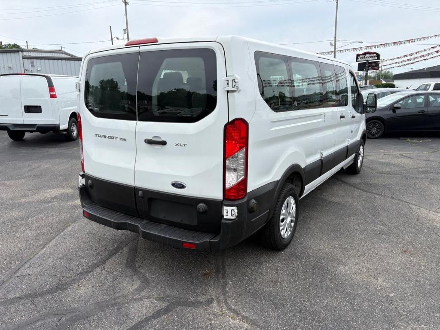 2019 WHITE FORD TRANSIT T-350 XLT (1FBZX2ZM7KK) with an 3.7L engine, Automatic transmission, located at 501 E. Columbia St., Springfield, OH, 45503, (800) 262-7122, 39.925262, -83.801796 - *** Clean CarFax w/ 25 Service Records *** Oil Change *** Inspection *** New Cabin and Air filter *** New Battery *** New Brakes *** 15 Passenger *** OPTIONAL EQUIPMENT/OTHER PREFERRED EQUIPMENT PKG.302A 3.73 RATIO REGULAR AXLE X73 9000# GVWR PACKAGE CHARCOAL CLOTH 2WAY SD ARBAGS 50 STATE E - Photo#2