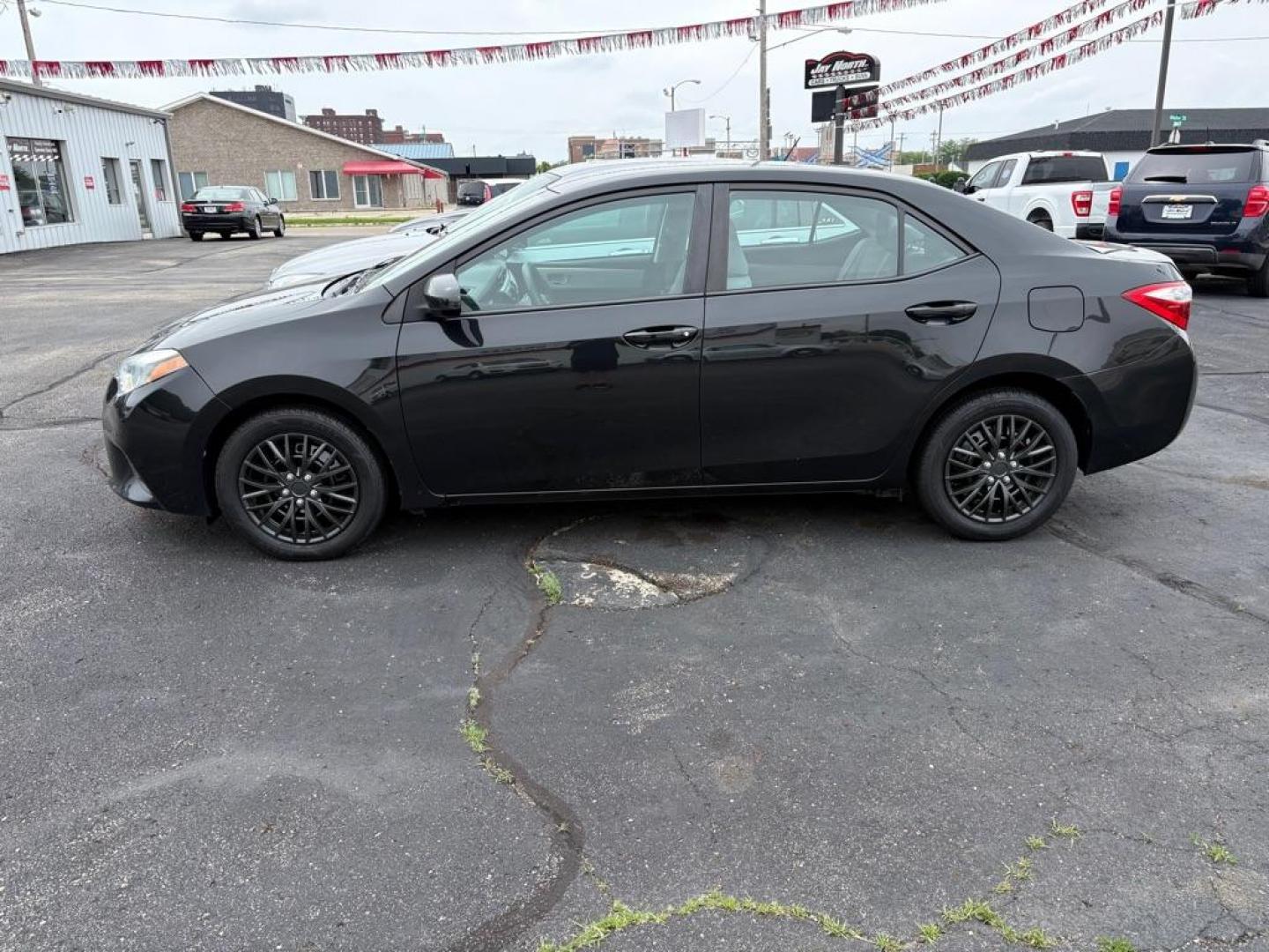 2014 BLACK TOYOTA COROLLA LE (2T1BURHE5EC) with an 1.8L engine, Automatic transmission, located at 501 E. Columbia St., Springfield, OH, 45503, (800) 262-7122, 39.925262, -83.801796 - *** Tune Up *** New Cabin and Air filter *** Inspection *** New wipers *** Oil Change *** FWD *** Jay North Auto has offered hand picked vehicles since 1965! Our customer's enjoy a NO pressure buying experience with a small town feel. We are a preferred dealer for many local credit unions an - Photo#4