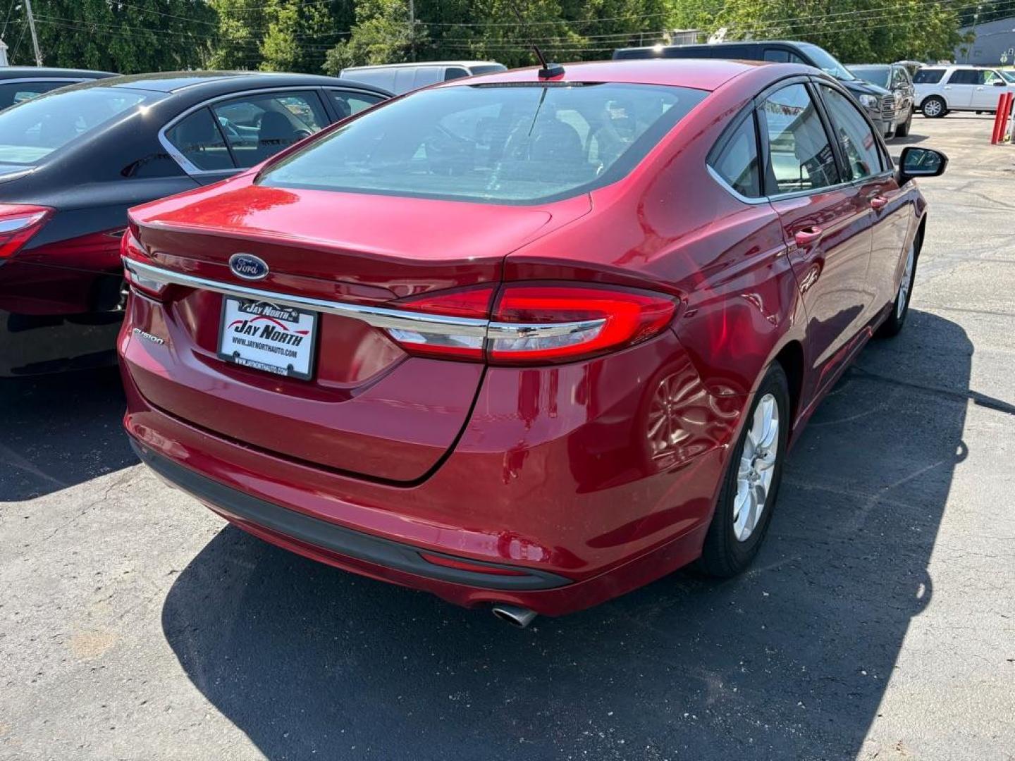 2017 RED FORD FUSION S (3FA6P0G73HR) with an 2.5L engine, Automatic transmission, located at 501 E. Columbia St., Springfield, OH, 45503, (800) 262-7122, 39.925262, -83.801796 - *** Low miles *** Tune Up *** New Front Brakes *** Oil Change *** New Battery *** New Cabin and Air filter*** Jay North Auto has offered hand picked vehicles since 1965! Our customer's enjoy a NO pressure buying experience with a small town feel. We are a preferred dealer for many local credit - Photo#1