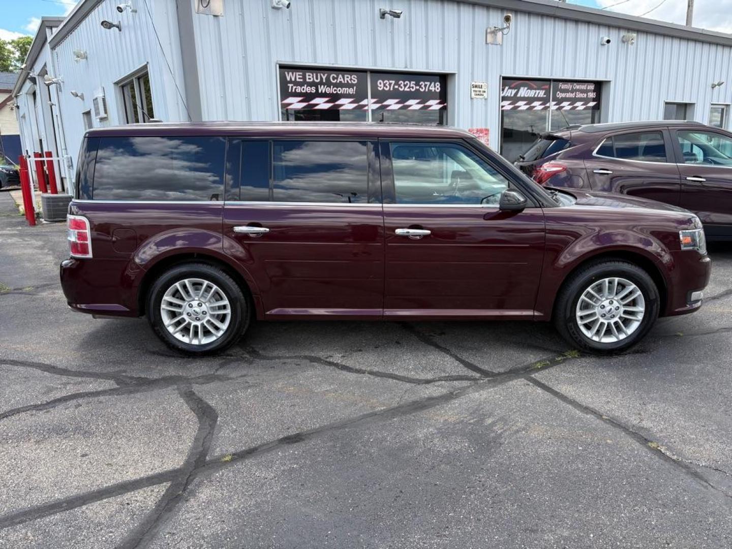 2018 MAROON FORD FLEX SEL (2FMGK5C84JB) with an 3.5L engine, Automatic transmission, located at 501 E. Columbia St., Springfield, OH, 45503, (800) 262-7122, 39.925262, -83.801796 - ***Clean Carfax***SEL***3.5L***Heated Leather Seating***3rd Row Seating***Blind Spot***Premium Audio***Remote Start***All New Brake Pads and Rotors***New Tires***Fresh Oil Change*** Jay North Auto has offered hand picked vehicles since 1965! Our customer's enjoy a NO pressure buying experience- Photo#1