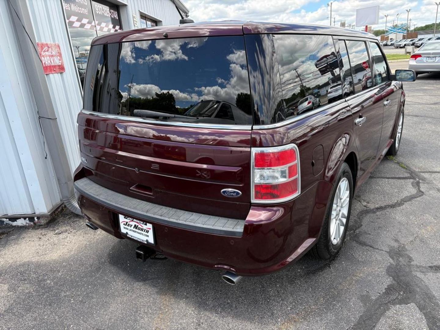 2018 MAROON FORD FLEX SEL (2FMGK5C84JB) with an 3.5L engine, Automatic transmission, located at 501 E. Columbia St., Springfield, OH, 45503, (800) 262-7122, 39.925262, -83.801796 - ***Clean Carfax***SEL***3.5L***Heated Leather Seating***3rd Row Seating***Blind Spot***Premium Audio***Remote Start***All New Brake Pads and Rotors***New Tires***Fresh Oil Change*** Jay North Auto has offered hand picked vehicles since 1965! Our customer's enjoy a NO pressure buying experience- Photo#2