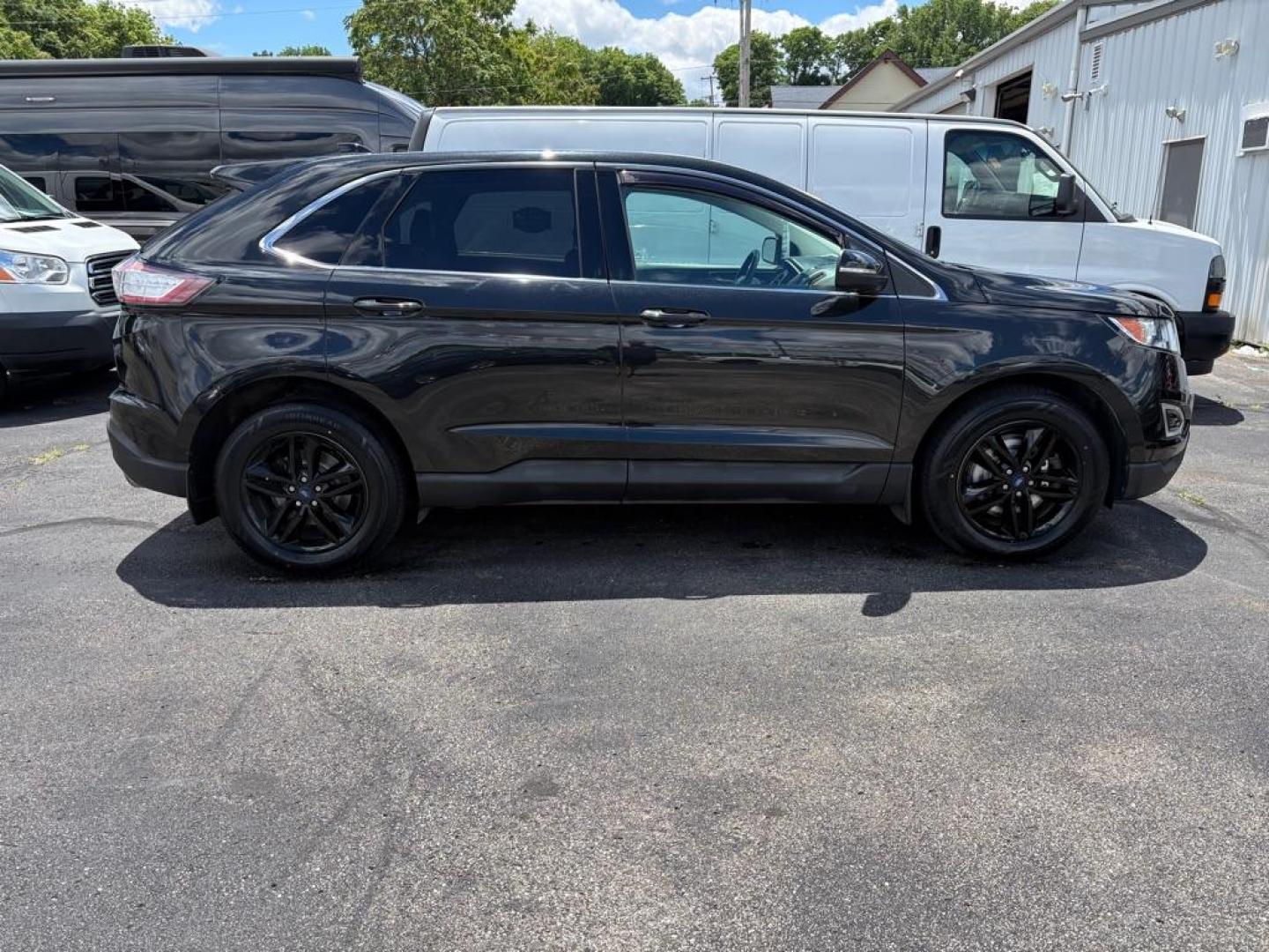 2015 BLACK FORD EDGE SEL (2FMTK4J86FB) with an 3.5L engine, Automatic transmission, located at 501 E. Columbia St., Springfield, OH, 45503, (800) 262-7122, 39.925262, -83.801796 - ***Only 79K Miles***SEL***AWD***Navigation***Blind Spot***Remote Start***Heated Leather Seating***Hands Free Lift Gate***New Tires***All New Brake Pads and Rotors***Fresh Oil Change***NICE*** Jay North Auto has offered hand picked vehicles since 1965! Our customer's enjoy a NO pressure buying e - Photo#1