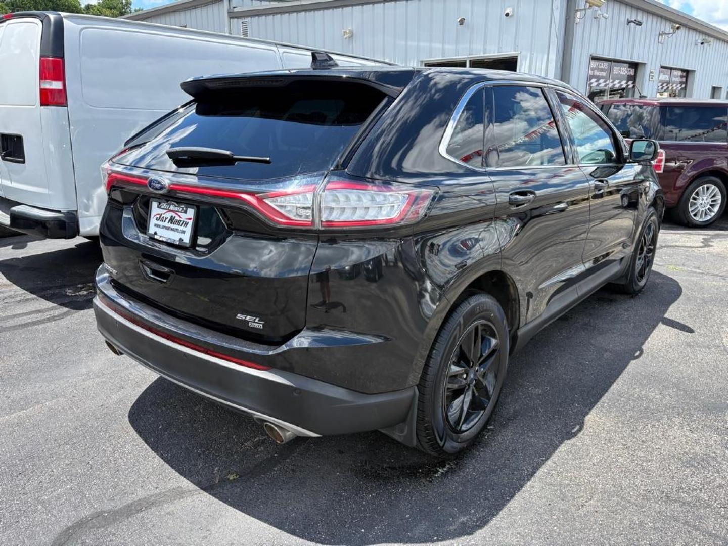 2015 BLACK FORD EDGE SEL (2FMTK4J86FB) with an 3.5L engine, Automatic transmission, located at 501 E. Columbia St., Springfield, OH, 45503, (800) 262-7122, 39.925262, -83.801796 - ***Only 79K Miles***SEL***AWD***Navigation***Blind Spot***Remote Start***Heated Leather Seating***Hands Free Lift Gate***New Tires***All New Brake Pads and Rotors***Fresh Oil Change***NICE*** Jay North Auto has offered hand picked vehicles since 1965! Our customer's enjoy a NO pressure buying e - Photo#2