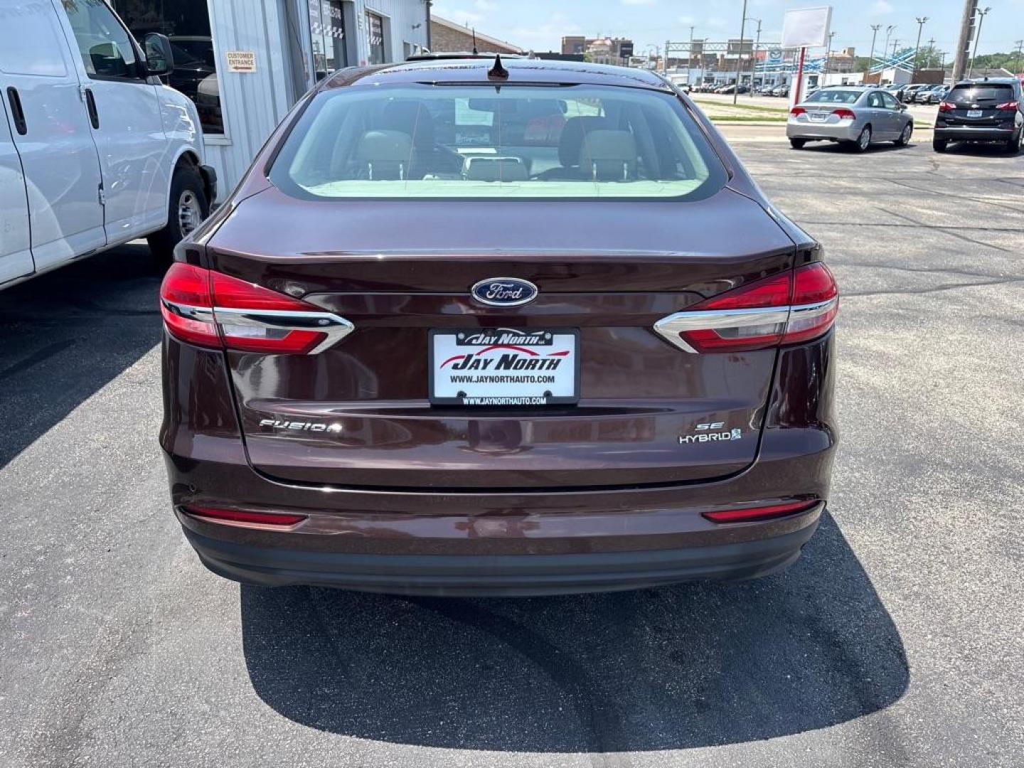 2019 RED FORD FUSION SE HYBRID (3FA6P0LUXKR) with an 2.0L engine, Continuously Variable transmission, located at 501 E. Columbia St., Springfield, OH, 45503, (800) 262-7122, 39.925262, -83.801796 - *** New Tires *** New Brakes *** New Cabin and Air filter *** Oil Change *** Inspection *** Hybrid *** Jay North Auto has offered hand picked vehicles since 1965! Our customer's enjoy a NO pressure buying experience with a small town feel. We are a preferred dealer for many local credit unions- Photo#3