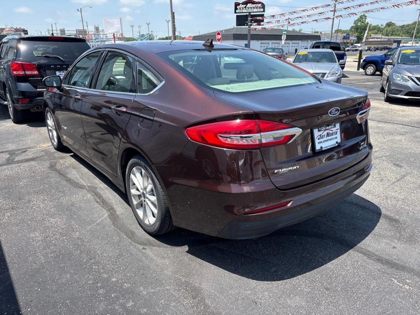 2019 RED FORD FUSION SE HYBRID (3FA6P0LUXKR) with an 2.0L engine, Continuously Variable transmission, located at 501 E. Columbia St., Springfield, OH, 45503, (800) 262-7122, 39.925262, -83.801796 - *** New Tires *** New Brakes *** New Cabin and Air filter *** Oil Change *** Inspection *** Hybrid *** Jay North Auto has offered hand picked vehicles since 1965! Our customer's enjoy a NO pressure buying experience with a small town feel. We are a preferred dealer for many local credit unions- Photo#4