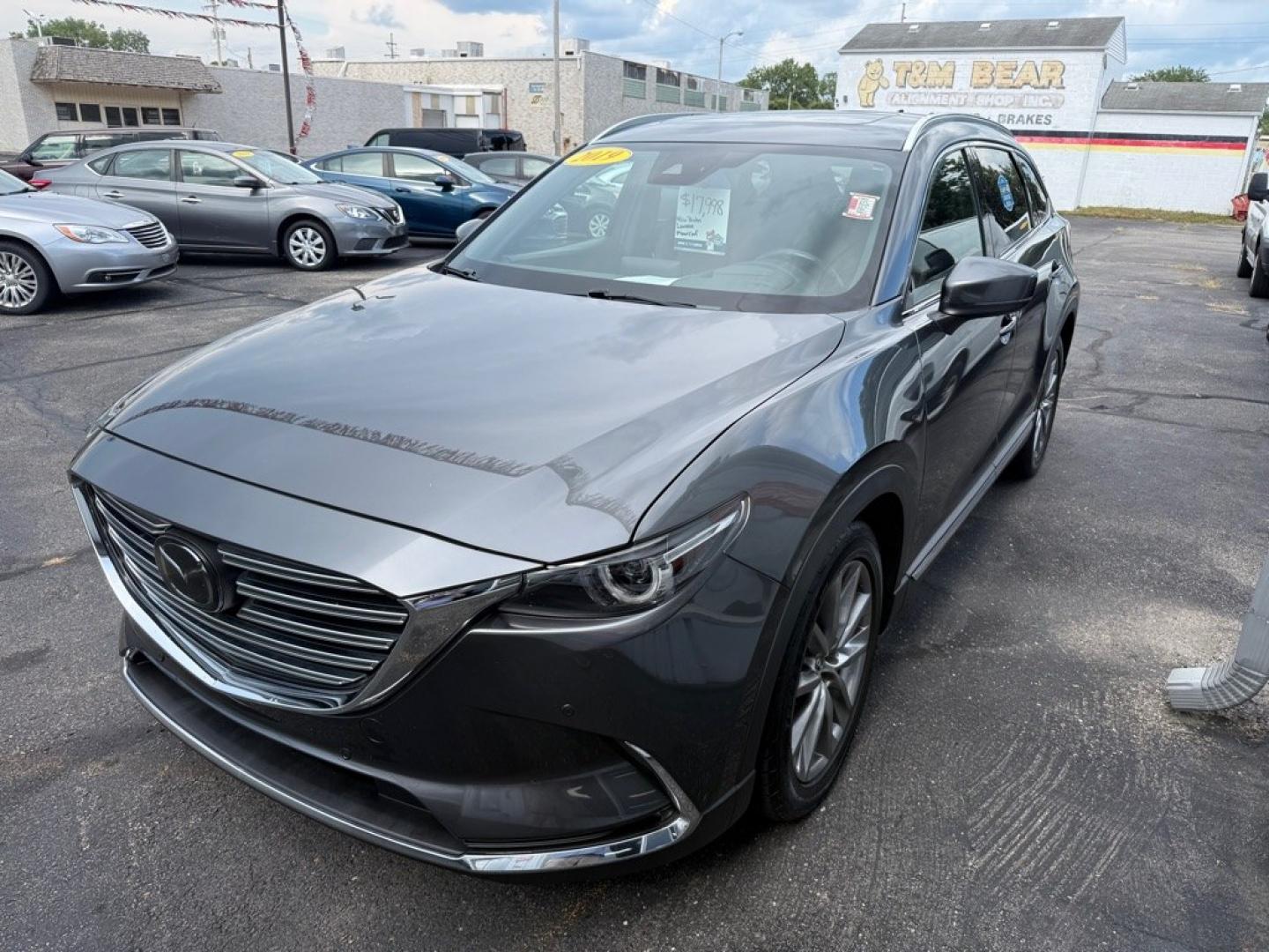 2019 GRAY MAZDA CX-9 SIGNATURE (JM3TCBEY7K0) with an 2.5L engine, Automatic transmission, located at 501 E. Columbia St., Springfield, OH, 45503, (800) 262-7122, 39.925262, -83.801796 - *** Signature *** 36 Service Records on CarFax *** All Wheel Drive *** Moonroof *** Leather *** Heated and Cooled Seating *** Back Up Camera *** Premium Audio *** Tune Up *** New Brakes *** New Wipers *** Oil Change *** Inspection *** New Cabin and Air filter *** Jay North Auto has offered hand- Photo#2
