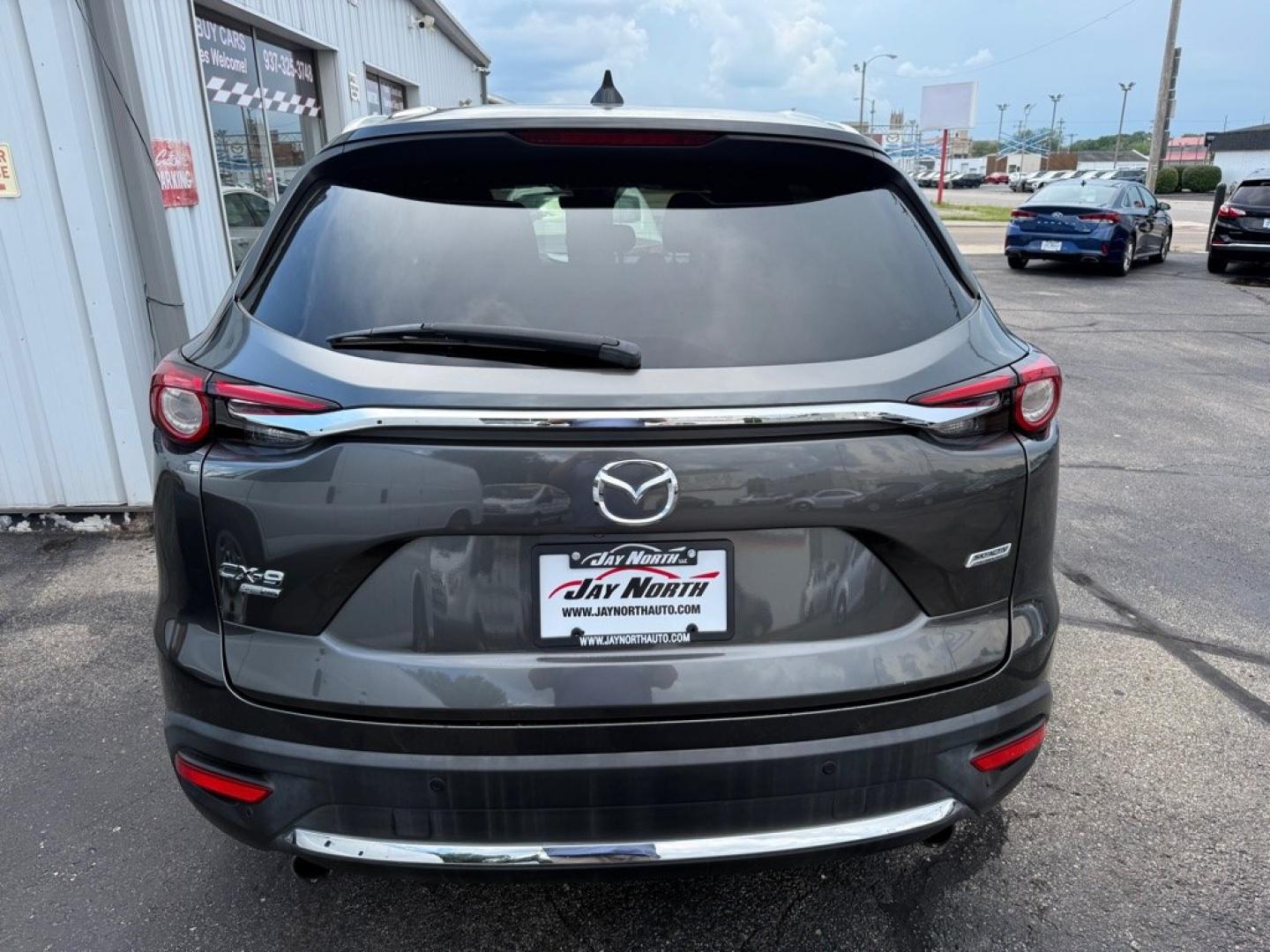 2019 GRAY MAZDA CX-9 SIGNATURE (JM3TCBEY7K0) with an 2.5L engine, Automatic transmission, located at 501 E. Columbia St., Springfield, OH, 45503, (800) 262-7122, 39.925262, -83.801796 - *** Signature *** 36 Service Records on CarFax *** All Wheel Drive *** Moonroof *** Leather *** Heated and Cooled Seating *** Back Up Camera *** Premium Audio *** Tune Up *** New Brakes *** New Wipers *** Oil Change *** Inspection *** New Cabin and Air filter *** Jay North Auto has offered hand- Photo#4