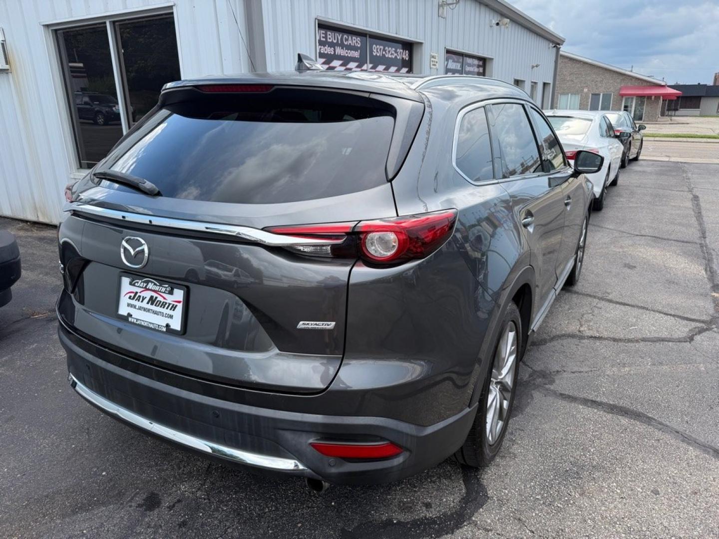 2019 GRAY MAZDA CX-9 SIGNATURE (JM3TCBEY7K0) with an 2.5L engine, Automatic transmission, located at 501 E. Columbia St., Springfield, OH, 45503, (800) 262-7122, 39.925262, -83.801796 - *** Signature *** 36 Service Records on CarFax *** All Wheel Drive *** Moonroof *** Leather *** Heated and Cooled Seating *** Back Up Camera *** Premium Audio *** Tune Up *** New Brakes *** New Wipers *** Oil Change *** Inspection *** New Cabin and Air filter *** Jay North Auto has offered hand- Photo#5