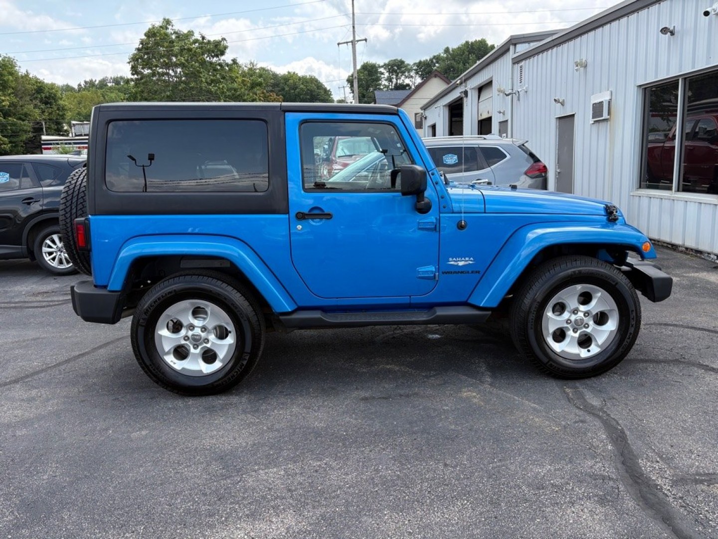 2015 BLUE JEEP WRANGLER SAHARA (1C4AJWBG1FL) with an 3.6L engine, Automatic transmission, located at 501 E. Columbia St., Springfield, OH, 45503, (800) 262-7122, 39.925262, -83.801796 - *** 1 Owner w/ Clean CarFax *** V6 Automatic 4x4 *** New Battery *** New Axle Seals *** New Brakes *** New Upgraded Oil Filter Housing *** New Air Filter *** Oil Change *** Inspection *** Premium Audio *** Hard Top *** Jay North Auto has offered hand picked vehicles since 1965! Our customer's en- Photo#1