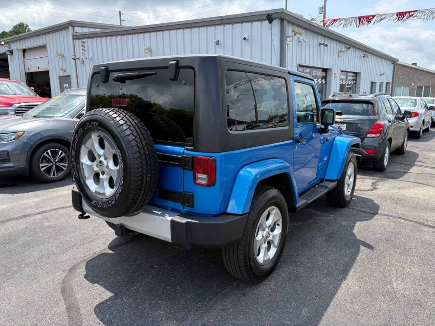 2015 BLUE JEEP WRANGLER SAHARA (1C4AJWBG1FL) with an 3.6L engine, Automatic transmission, located at 501 E. Columbia St., Springfield, OH, 45503, (800) 262-7122, 39.925262, -83.801796 - *** 1 Owner w/ Clean CarFax *** V6 Automatic 4x4 *** New Battery *** New Axle Seals *** New Brakes *** New Upgraded Oil Filter Housing *** New Air Filter *** Oil Change *** Inspection *** Premium Audio *** Hard Top *** Jay North Auto has offered hand picked vehicles since 1965! Our customer's en- Photo#2