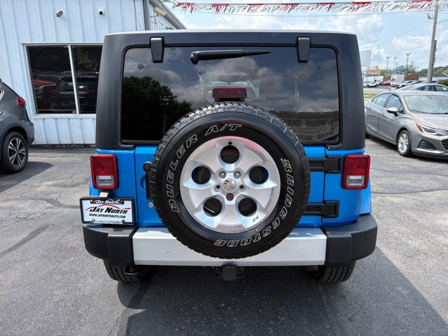 2015 BLUE JEEP WRANGLER SAHARA (1C4AJWBG1FL) with an 3.6L engine, Automatic transmission, located at 501 E. Columbia St., Springfield, OH, 45503, (800) 262-7122, 39.925262, -83.801796 - *** 1 Owner w/ Clean CarFax *** V6 Automatic 4x4 *** New Battery *** New Axle Seals *** New Brakes *** New Upgraded Oil Filter Housing *** New Air Filter *** Oil Change *** Inspection *** Premium Audio *** Hard Top *** Jay North Auto has offered hand picked vehicles since 1965! Our customer's en- Photo#3