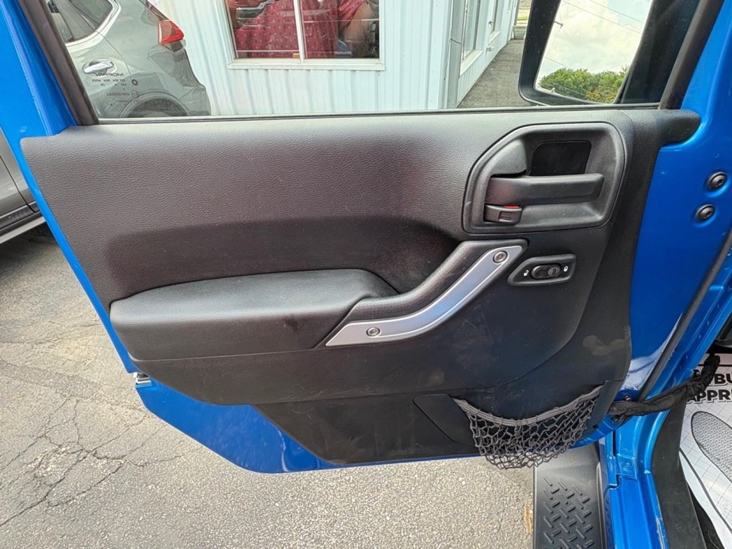 2015 BLUE JEEP WRANGLER SAHARA (1C4AJWBG1FL) with an 3.6L engine, Automatic transmission, located at 501 E. Columbia St., Springfield, OH, 45503, (800) 262-7122, 39.925262, -83.801796 - *** 1 Owner w/ Clean CarFax *** V6 Automatic 4x4 *** New Battery *** New Axle Seals *** New Brakes *** New Upgraded Oil Filter Housing *** New Air Filter *** Oil Change *** Inspection *** Premium Audio *** Hard Top *** Jay North Auto has offered hand picked vehicles since 1965! Our customer's en- Photo#7