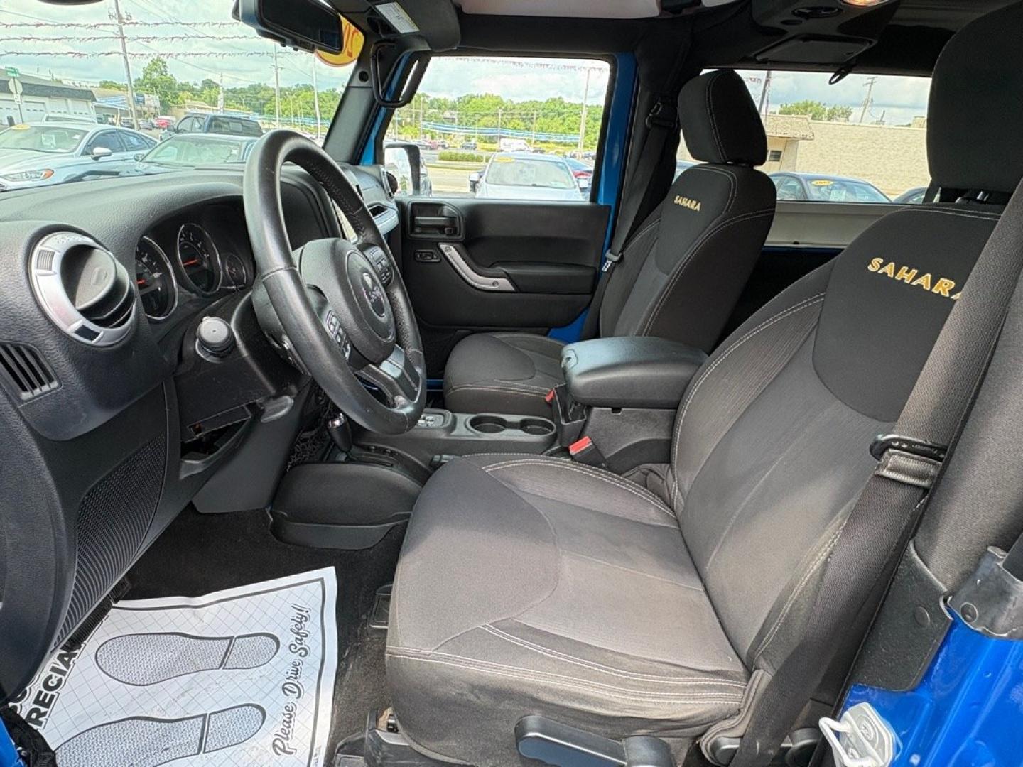 2015 BLUE JEEP WRANGLER SAHARA (1C4AJWBG1FL) with an 3.6L engine, Automatic transmission, located at 501 E. Columbia St., Springfield, OH, 45503, (800) 262-7122, 39.925262, -83.801796 - *** 1 Owner w/ Clean CarFax *** V6 Automatic 4x4 *** New Battery *** New Axle Seals *** New Brakes *** New Upgraded Oil Filter Housing *** New Air Filter *** Oil Change *** Inspection *** Premium Audio *** Hard Top *** Jay North Auto has offered hand picked vehicles since 1965! Our customer's en- Photo#8