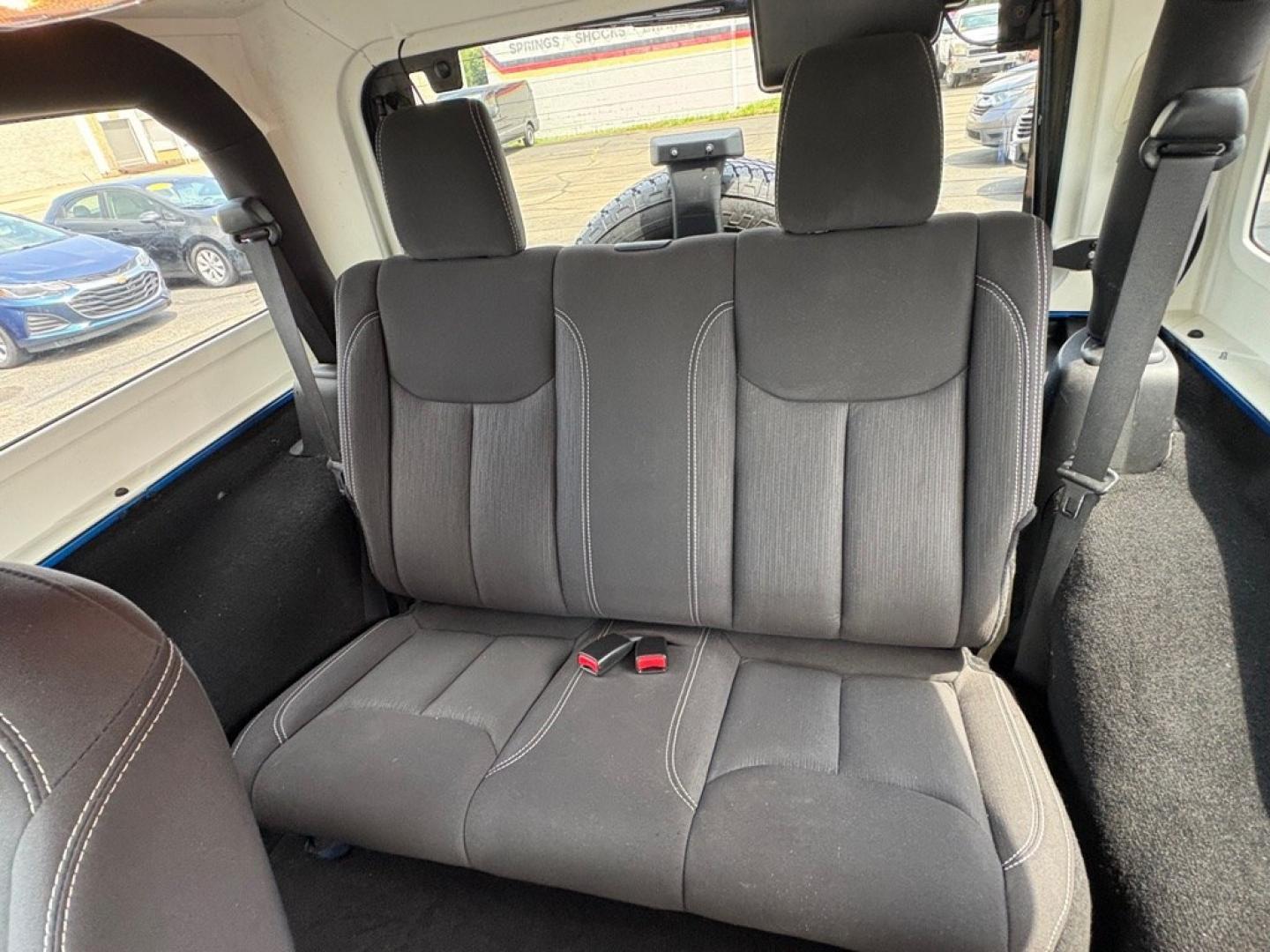 2015 BLUE JEEP WRANGLER SAHARA (1C4AJWBG1FL) with an 3.6L engine, Automatic transmission, located at 501 E. Columbia St., Springfield, OH, 45503, (800) 262-7122, 39.925262, -83.801796 - *** 1 Owner w/ Clean CarFax *** V6 Automatic 4x4 *** New Battery *** New Axle Seals *** New Brakes *** New Upgraded Oil Filter Housing *** New Air Filter *** Oil Change *** Inspection *** Premium Audio *** Hard Top *** Jay North Auto has offered hand picked vehicles since 1965! Our customer's en- Photo#10