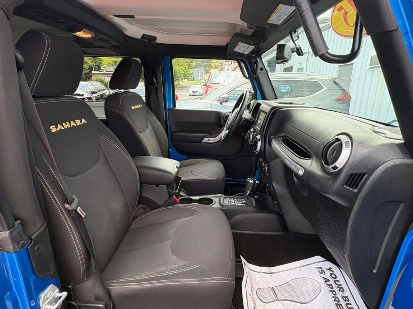 2015 BLUE JEEP WRANGLER SAHARA (1C4AJWBG1FL) with an 3.6L engine, Automatic transmission, located at 501 E. Columbia St., Springfield, OH, 45503, (800) 262-7122, 39.925262, -83.801796 - *** 1 Owner w/ Clean CarFax *** V6 Automatic 4x4 *** New Battery *** New Axle Seals *** New Brakes *** New Upgraded Oil Filter Housing *** New Air Filter *** Oil Change *** Inspection *** Premium Audio *** Hard Top *** Jay North Auto has offered hand picked vehicles since 1965! Our customer's en- Photo#17