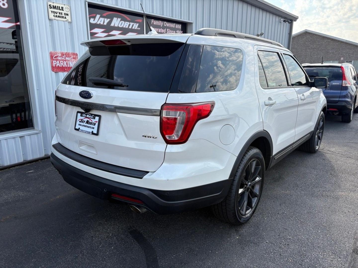 2019 WHITE FORD EXPLORER XLT (1FM5K8D83KG) with an 3.5L engine, Automatic transmission, located at 501 E. Columbia St., Springfield, OH, 45503, (800) 262-7122, 39.925262, -83.801796 - ***Clean Carfax***XLT Sport Appearance Package***Heated Leather and Suede Seating***Navigation***Blind Spot***Power Lift Gate***2nd Row Bucket Seats***Heated Steering Wheel***New Tires***All New Brakes***Fresh Oil Change*** Jay North Auto has offered hand picked vehicles since 1965! Our custome- Photo#2