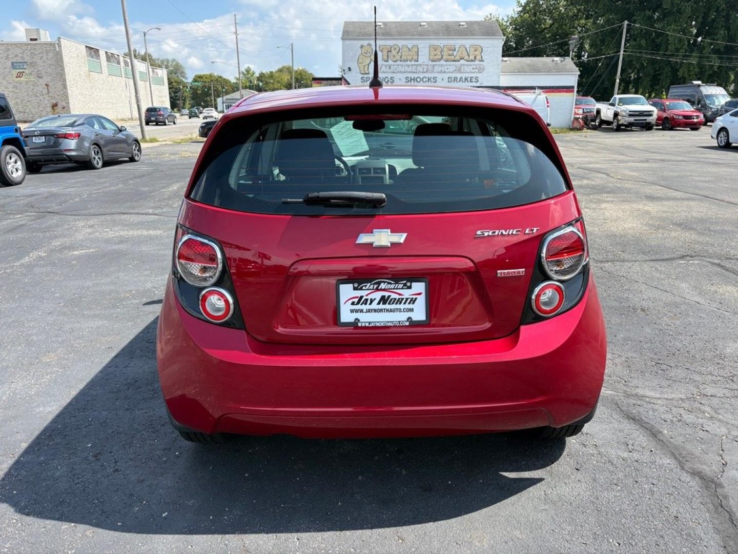 2013 RED CHEVROLET SONIC LT (1G1JC6SB8D4) with an 1.4L engine, Automatic transmission, located at 501 E. Columbia St., Springfield, OH, 45503, (800) 262-7122, 39.925262, -83.801796- Photo#3