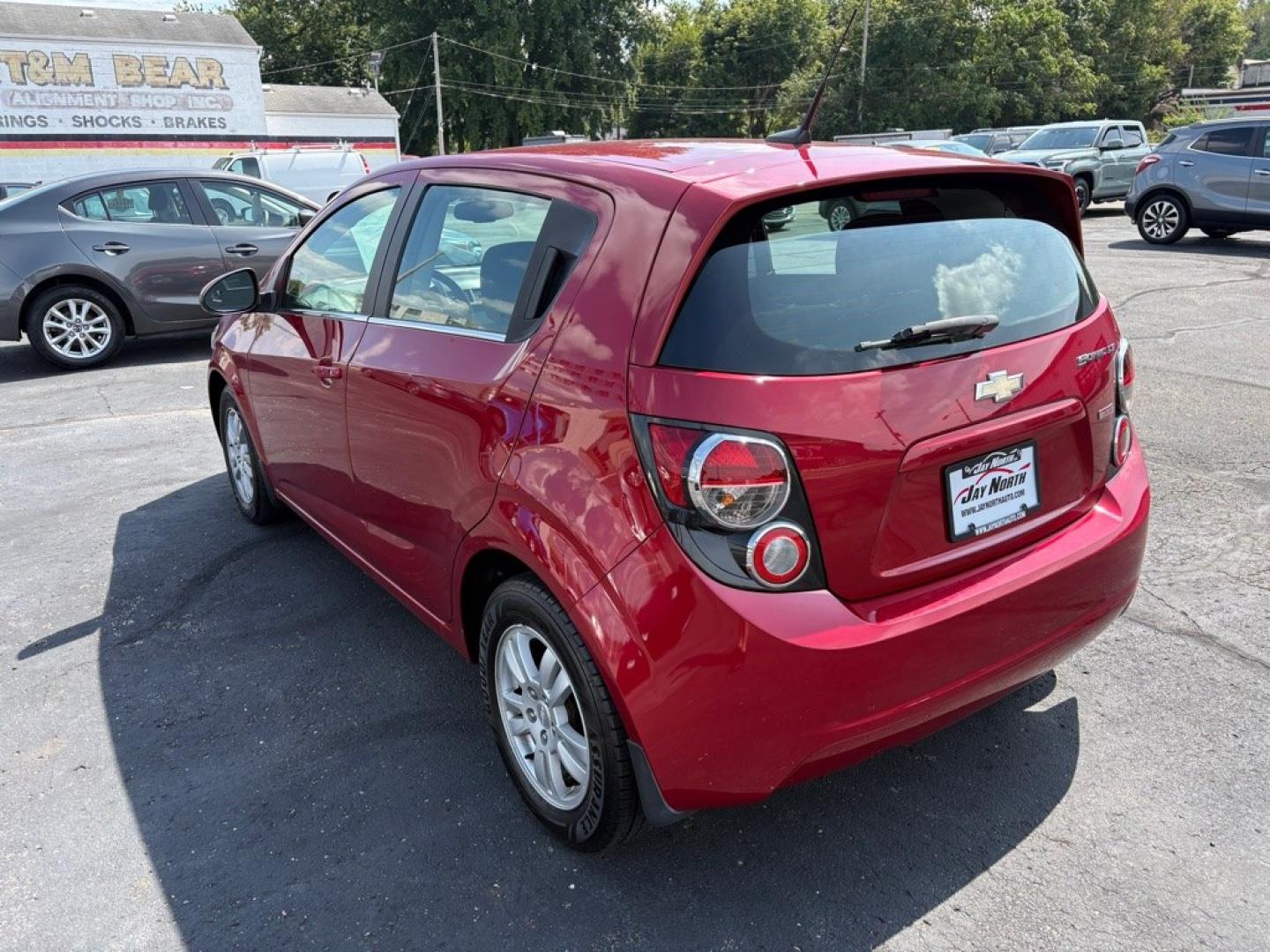 2013 RED CHEVROLET SONIC LT (1G1JC6SB8D4) with an 1.4L engine, Automatic transmission, located at 501 E. Columbia St., Springfield, OH, 45503, (800) 262-7122, 39.925262, -83.801796- Photo#4