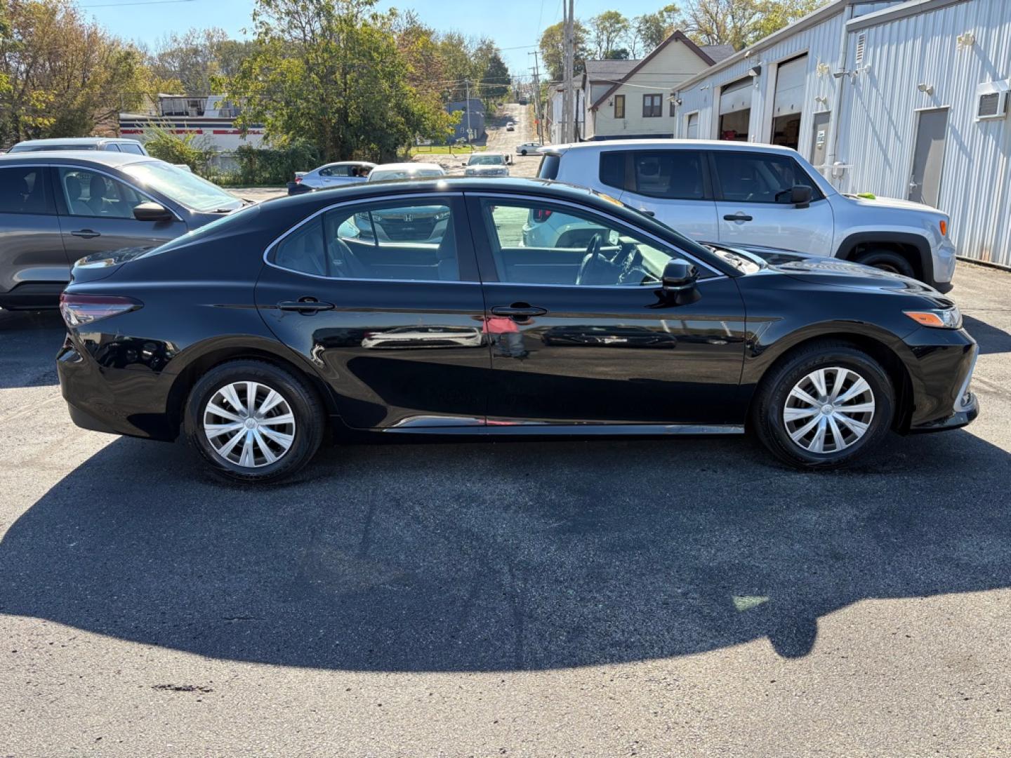 2023 BLACK TOYOTA CAMRY LE HYBRID (4T1C31AK5PU) with an 2.5L engine, Continuously Variable transmission, located at 501 E. Columbia St., Springfield, OH, 45503, (800) 262-7122, 39.925262, -83.801796 - **2023 Toyota Camry Hybrid LE - 1 Owner, Clean CARFAX and 17 Service Records!** Check out this 2023 Toyota Camry Hybrid LE! Powered by a fuel-efficient 2.5L 4-cylinder hybrid engine, this Camry offers a smooth, comfortable ride, excellent fuel economy, and Toyota's proven hybrid technology!- Photo#1